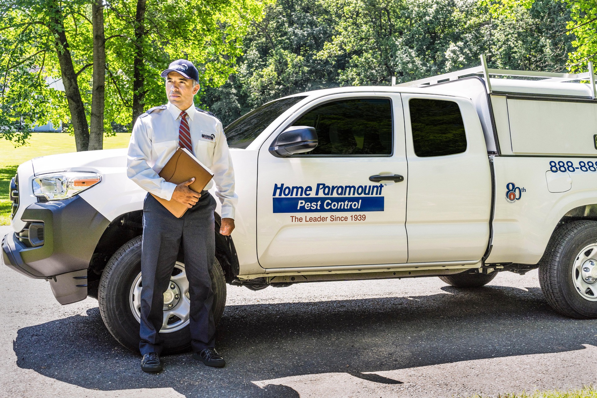 Home Paramount Pest Control Employee with a Service Truck